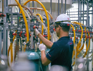 Employee checking water levels for deionization